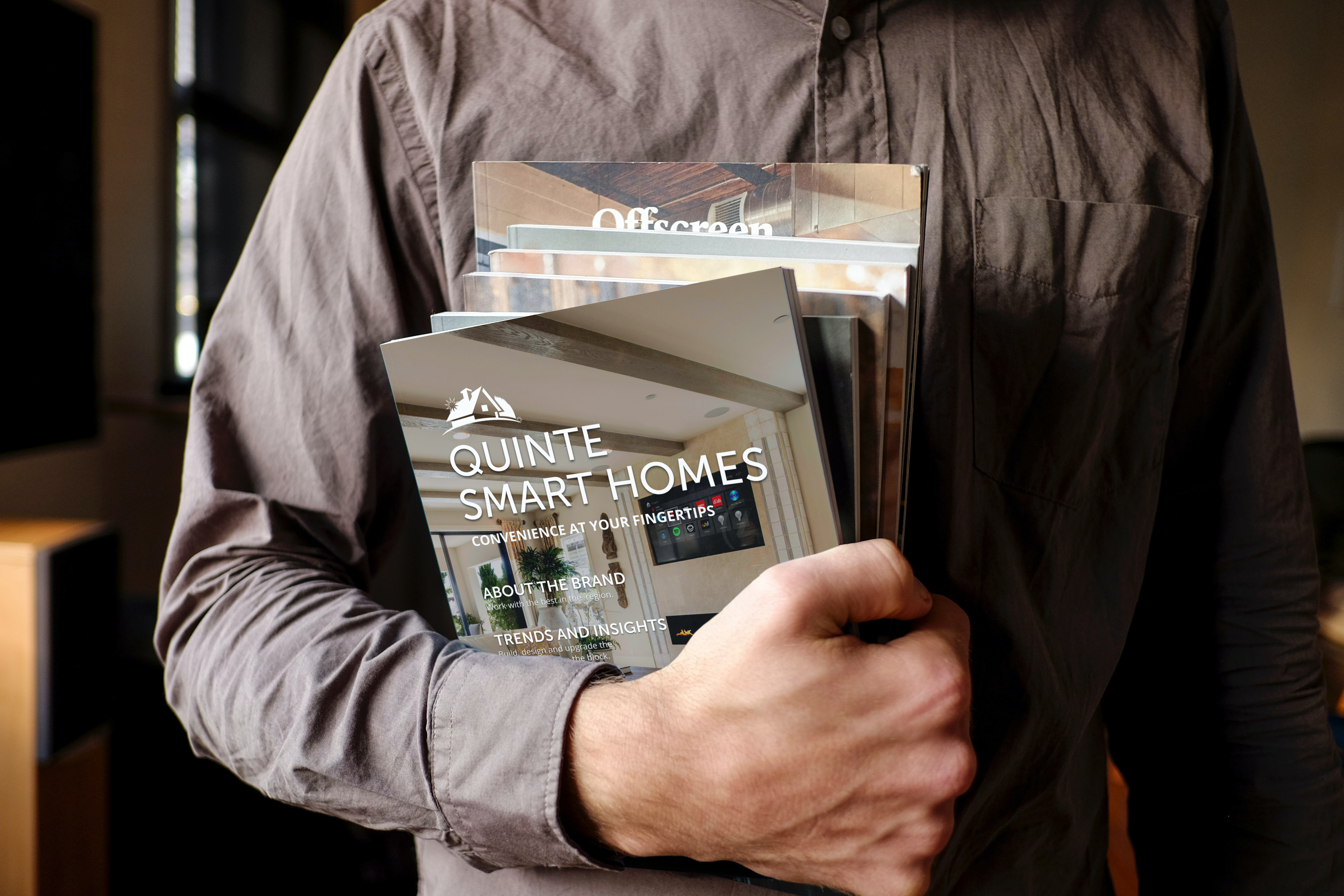 Portrait magazine cover in the hand of a man_Quinte Smart Homes New Client Booklet_DRAFT 3